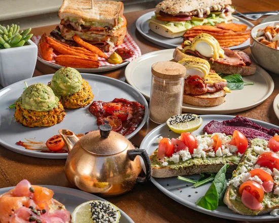 A colourful spread of toasties, avocado toast, fritters and tea at Absolute Cravings